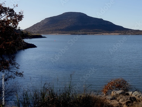 Scenic view of Lake Lawtonka with the 2,464-foot Mt. Scott in the background in the Comanche County of Oklahoma.  photo