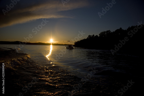 Boat at sunset in lake Mälaren, stockholm, sweden