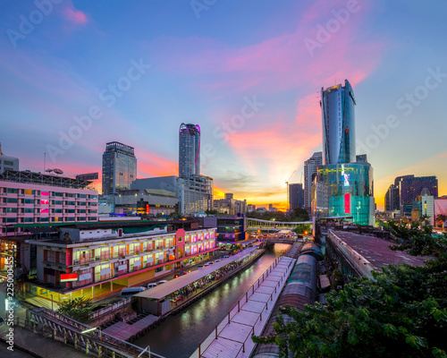 .Skyscraper and Pratunam pier in Bangkok; water transportation by speed boat is one of the alternative choice for solving the traffic congestion problem in Bangkok.