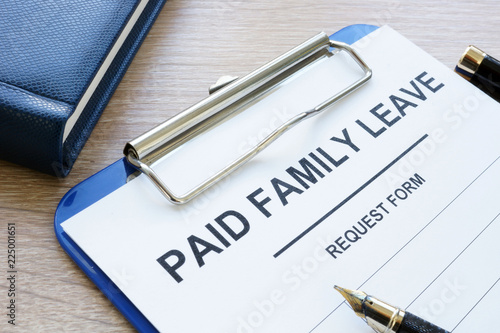 Canvas Print Paid family leave form in clipboard and note pad.