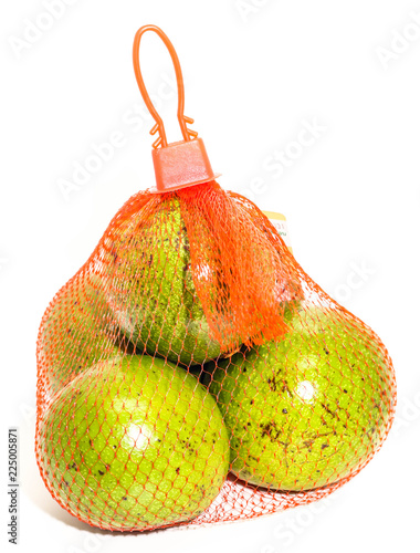 Closeup of green thai avocado in net packing