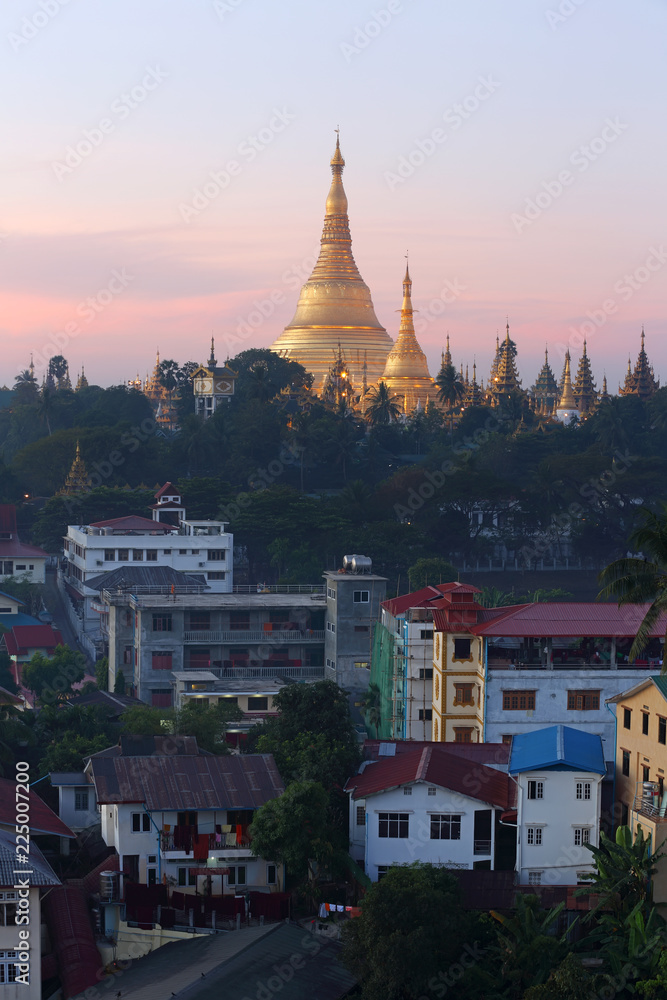 Shwedagon Pagoda Temple with village below in the during sunrise at Yangon, Myanmar (Burma)