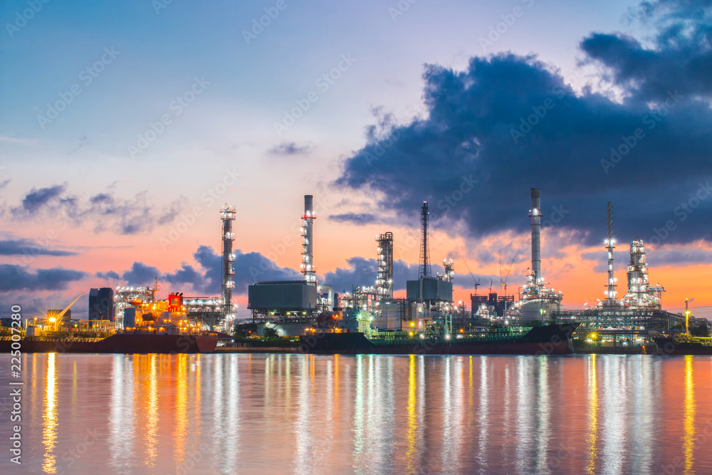  Oil refinery plant at sunrise with sky background