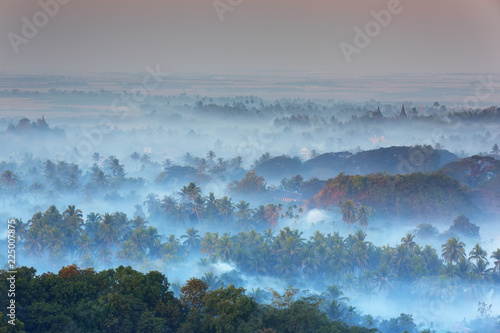 Sunrise over pagodas of Mrauk U in the misty at the northern Rakhine State, Myanmar  (Burma) photo