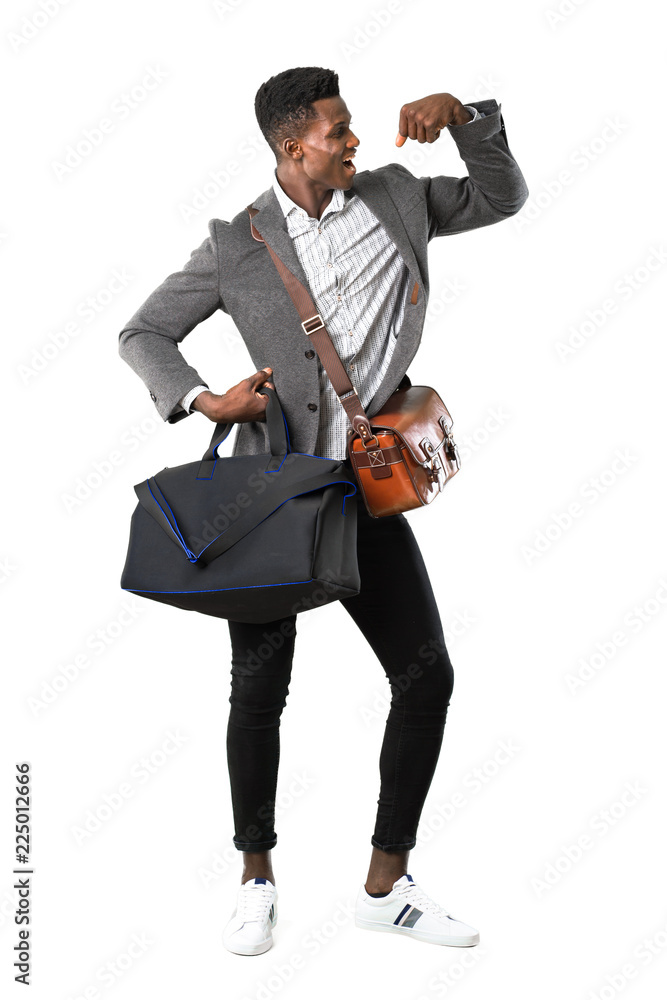 Naklejka premium Full body of African american business man traveling with suitcases celebrating a victory in winner position on white background