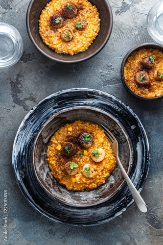Pumpkin risotto in a table on stone background