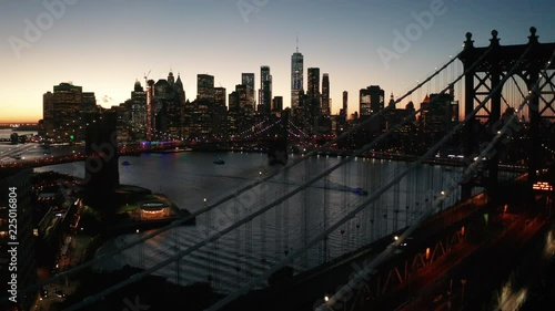 flying over Manhattan Bridge towards dusk view of NYC