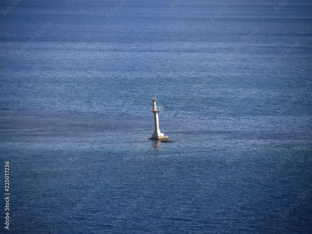 Fototapeta premium Wide shot of a buoy off the shores of Roatan, Honduras