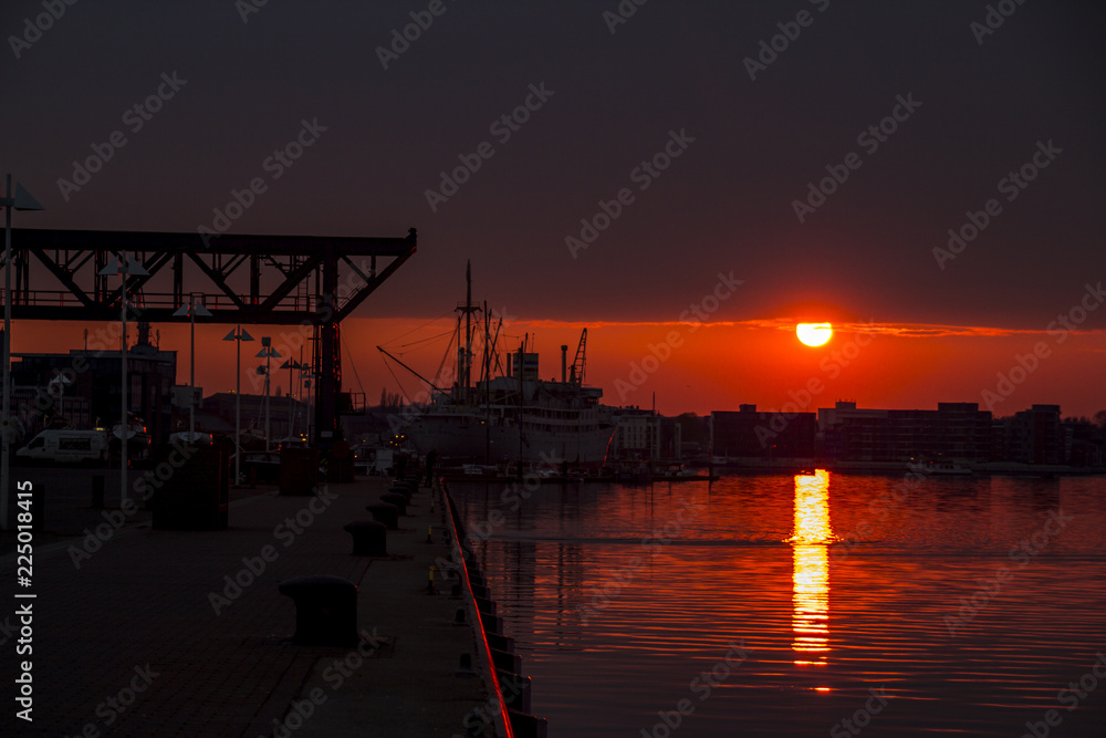 Fototapeta premium sunset in port of rostock germany