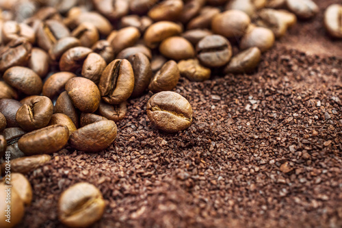 Background of ground coffee and coffee beans.