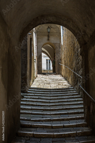 Narrow streets and cobblestone stairway in Pitigliano, Tuscany