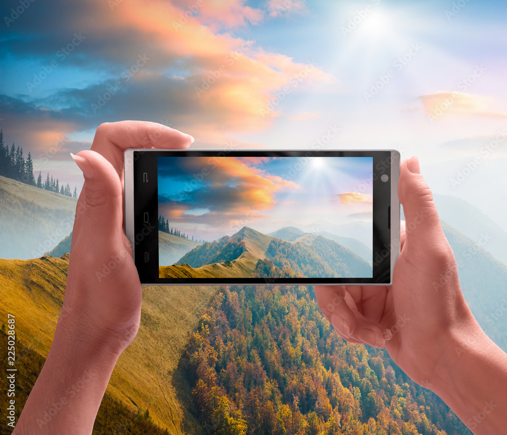 Carpathian mountain valley on a screen of smartphone