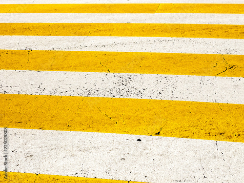 Zebra crossing, street pedestrian crosswalk with white and yellow stripes