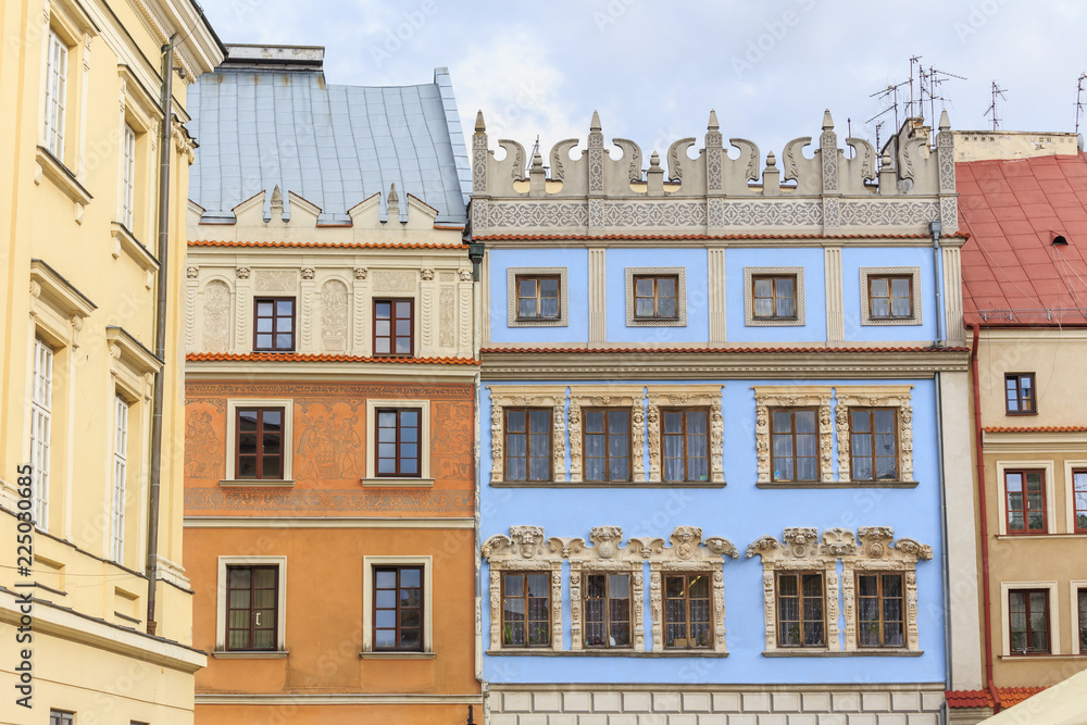Fototapeta premium Historic tenement House Rynek 12 ( in the middle) in Lublin, with azure facade, so-called Konopnicow House, with mannerist decoration of front elevation, from XVI th centuru
