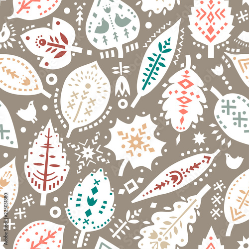 Vector seamless pattern of autumn leaves with ethnic ornaments.