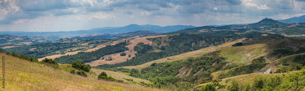 Panoramic view of a Tuscan hilltop town and landscape