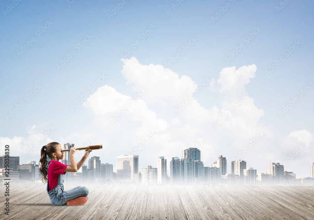 Concept of careless happy childhood with girl dreaming about future Concept of careless happy childhood with girl dreaming about future