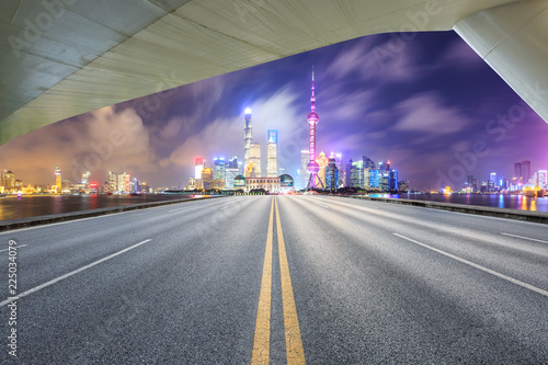 Photography Empty asphalt road and modern city buildings in Shanghai at night