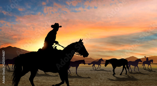 Fototapeta Naklejka Na Ścianę i Meble -  Cowboy leading horse herd
