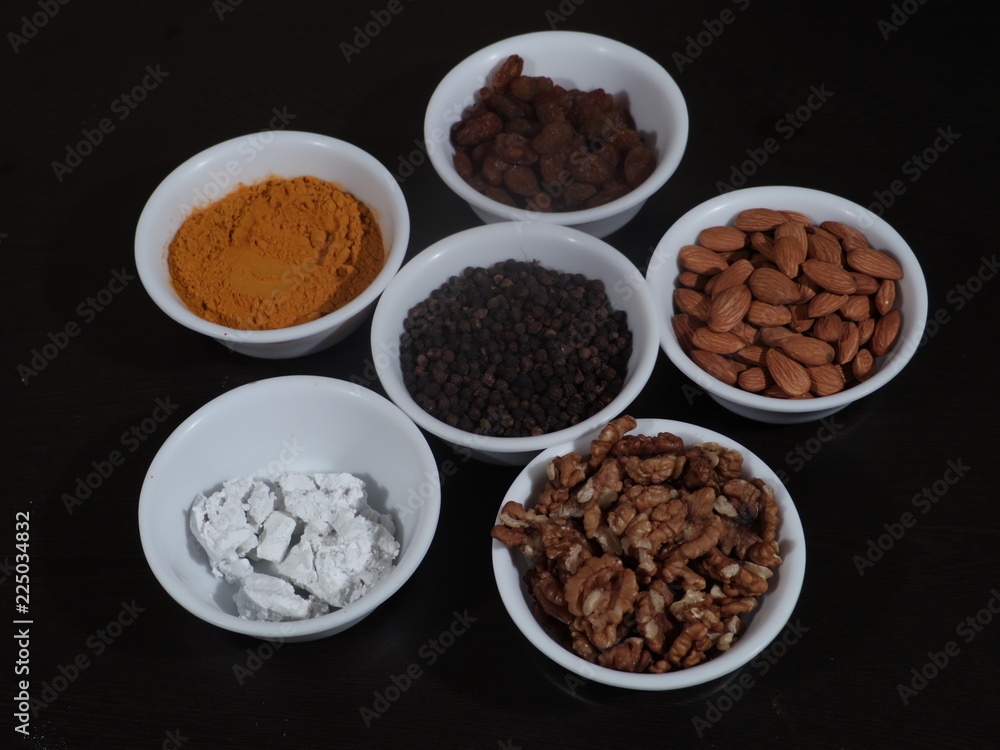 Turmeric, Kismish, Almonds, Badam, Akhrot, Walnuts, Chuna, Limestone, Haldi, Black Pepper, Kali Mirch, Wooden Background, Turmeric, Kismish, Almonds, Badam, Akhrot, Walnuts, Chuna, Limestone, Haldi, Black Pepper, Kali Mirch, Wooden Background,