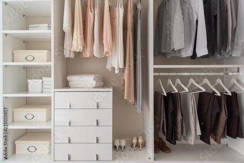 modern closet with clothes