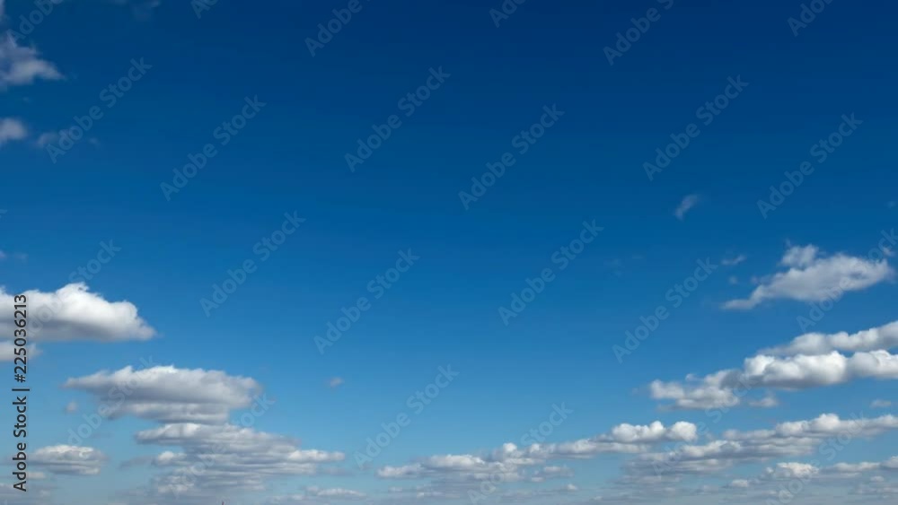 TIME-LAPSE: Flying forward small white clouds on a blue sky TIME-LAPSE: Flying forward small white clouds on a blue sky