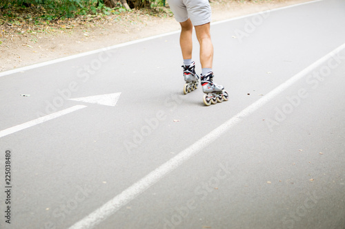 arrow on the road man rides on rollers in no focus