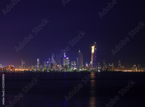 The Skyline Of Kuwait City At Night Glitters With Light