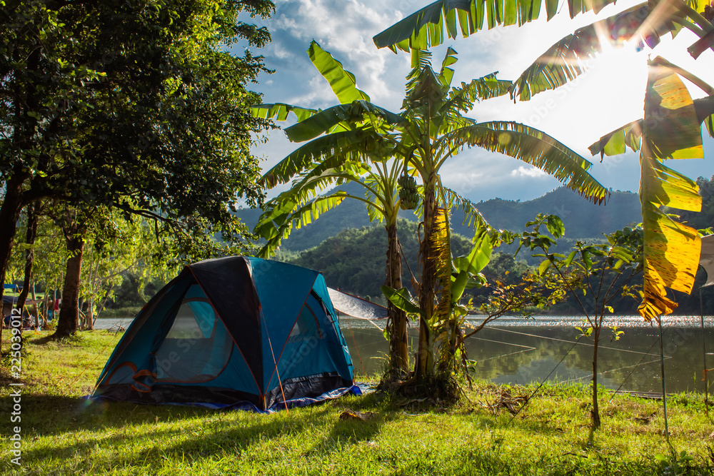 Field Tent and banana trees ,The background of mountains and water.