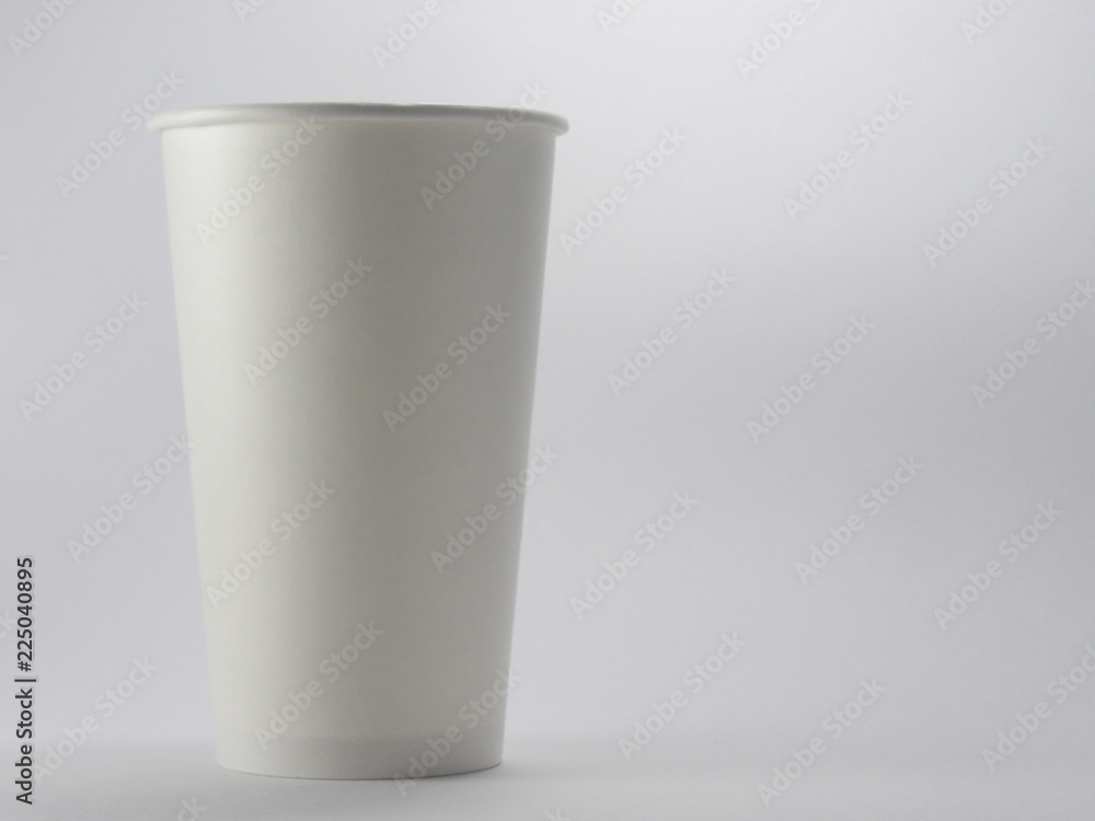 Close up of takeaway white blank paper coffee cup mock up isolated on white background.Disposable tableware is used for hot drink in food store.Although recyclable, it's not eco-friendly to the earth. Close up of takeaway white blank paper coffee cup mock up isolated on white background.Disposable tableware is used for hot drink in food store.Although recyclable, it's not eco-friendly to the earth.