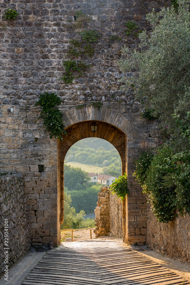 Gateway at sunset in the historic walled town of Monteriggioni, Tuscany