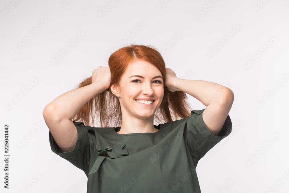 Young redhead woman posing on white background Young redhead woman posing on white background
