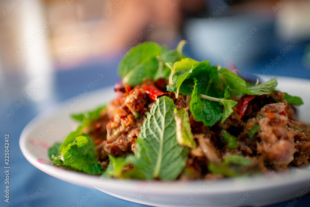 Pork spicy with spicy, arranged from the side, behind the blurred. Pork spicy with spicy, arranged from the side, behind the blurred.