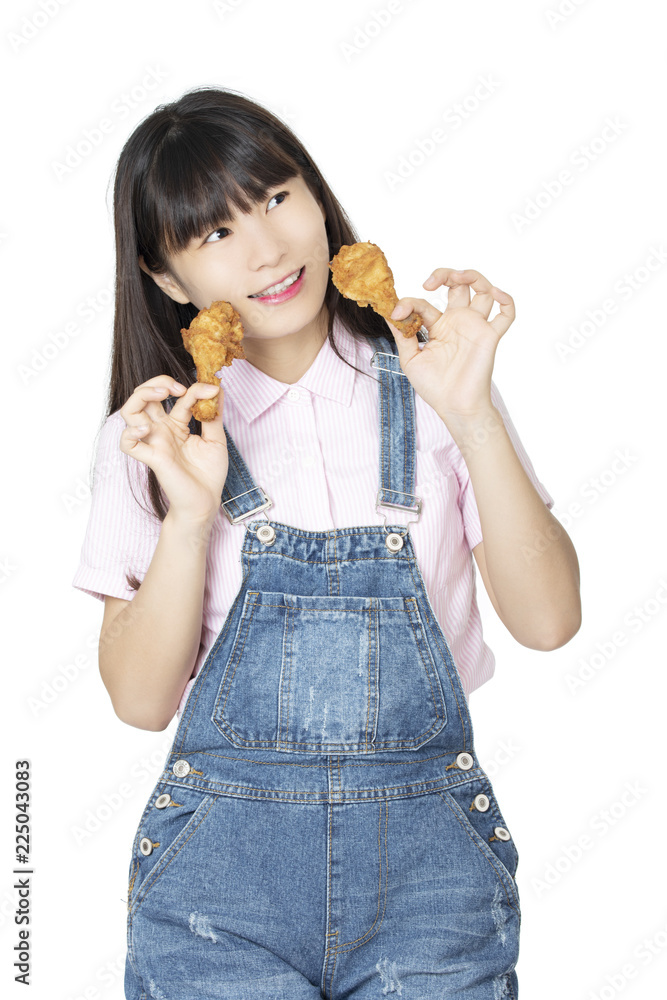 Chinese woman eating fried chicken drumstick isolated on white background Chinese woman eating fried chicken drumstick isolated on white background
