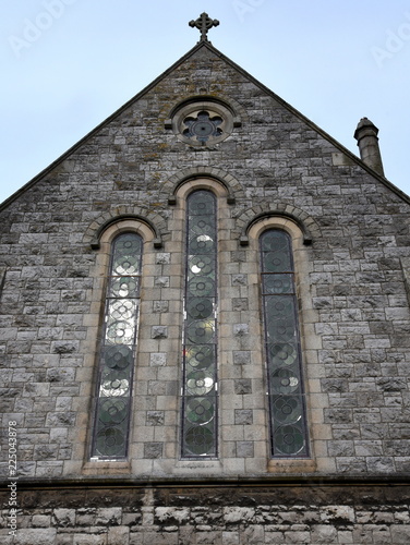 Giebel der Parish Church of the Assumption in Howth mit langen Buntglasfenstern photo