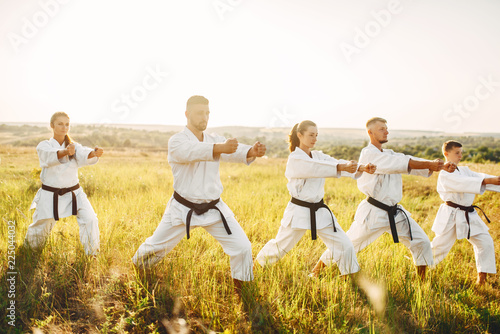 Karate group with master in white kimono