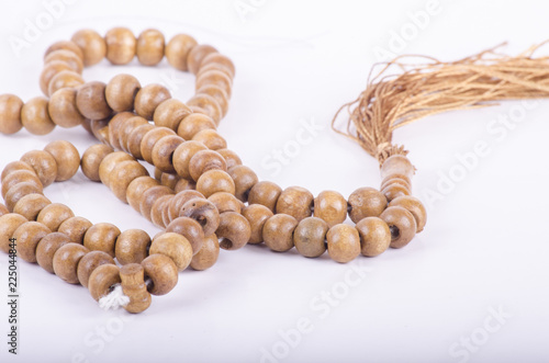Muslim rosary prayer beads on white background