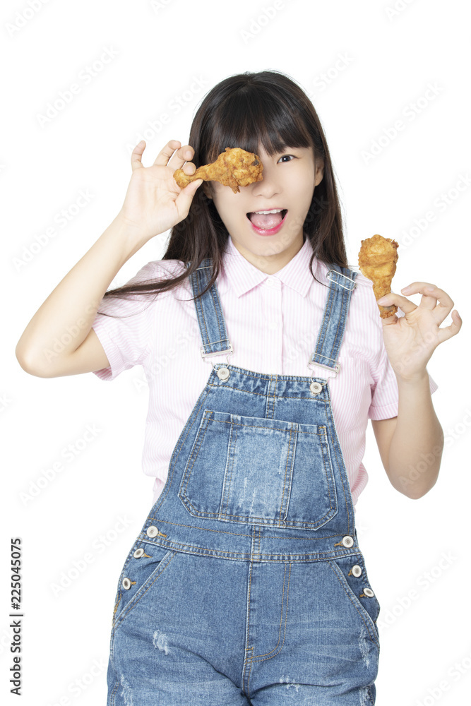 Chinese woman eating fried chicken drumstick isolated on white background Chinese woman eating fried chicken drumstick isolated on white background