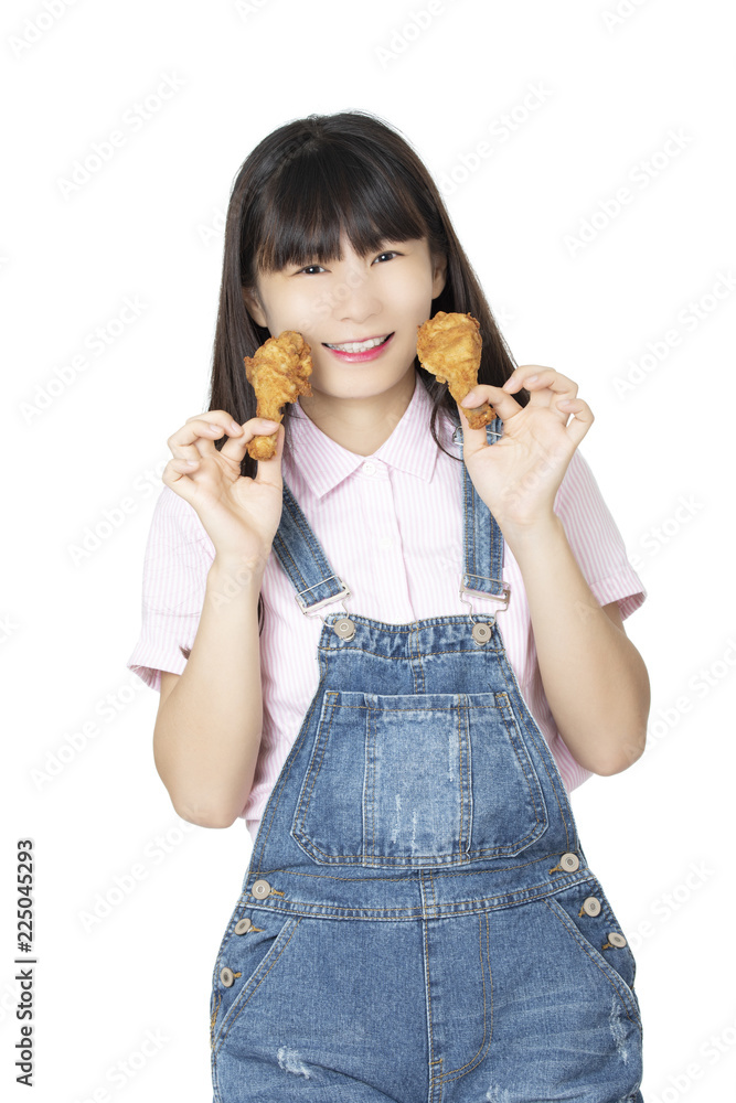 Chinese woman eating fried chicken drumstick isolated on white background Chinese woman eating fried chicken drumstick isolated on white background