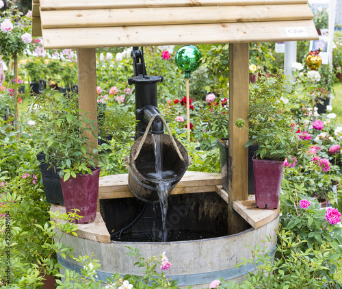 A well with a wooden barrel and canopy. Baden Baden, Baden Wuerttemberg, Germany, Europe