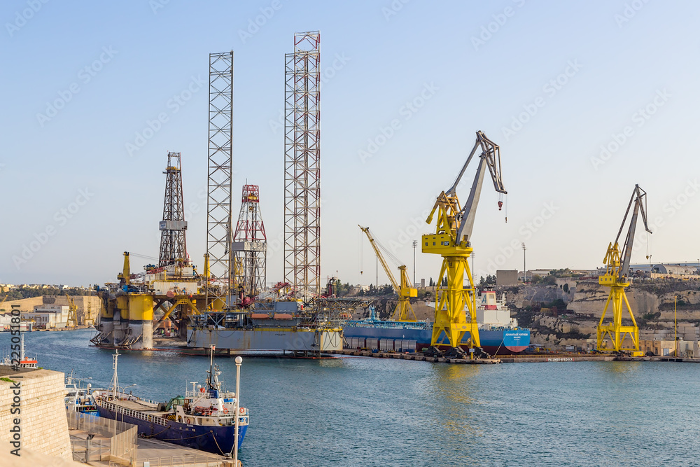 Senglea, Malta. Offshore drilling platforms and ships in the territory of the shipyard in French Creek Bay