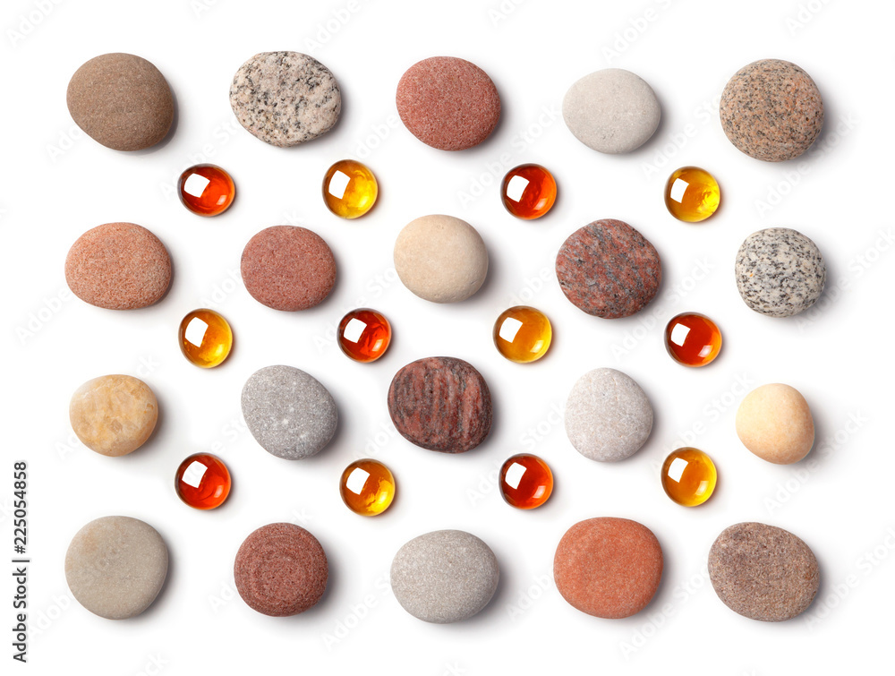 Pattern of colored pebbles and orange glass beads isolated on white background. - obrazy, fototapety, plakaty 