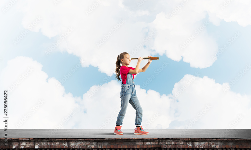 Concept of careless happy childhood with girl exploring this world Concept of careless happy childhood with girl exploring this world