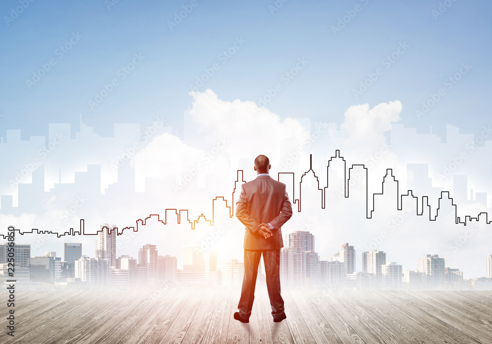 Motivation and inspiration concept with modern cityscape and businessman observing it Motivation and inspiration concept with modern cityscape and businessman observing it