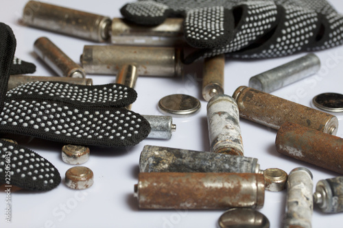 Wallpaper Mural Used finger-wound batteries covered with corrosion. Next working gloves. Recycling. Torontodigital.ca