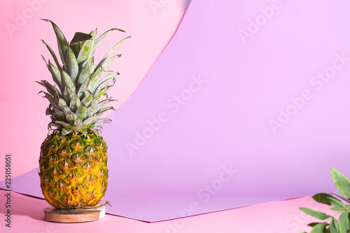 Creative layout made of pineapple on pink background. Food concept with copy space