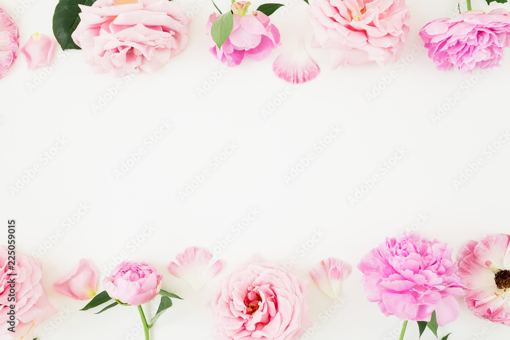 Floral frame of pink pastel flowers on white background. Flat lay, Top view. Flowers texture.