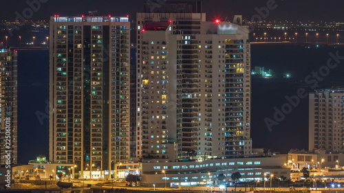 Aerial skyline of Abu Dhabi city centre from above night timelapse