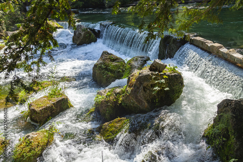 Munich, Germany, on August 22, 2018. Park with stream and artificial wave photo