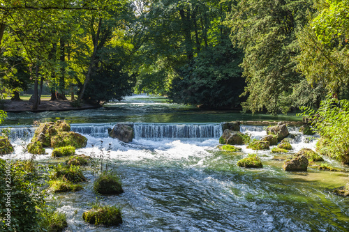 Munich, Germany, on August 22, 2018. Park with stream and artificial wave photo